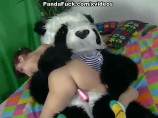 Enchanting brunette girl seducing Panda bear