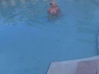 Brazzer Blonde clips her charming TITS in a PUBLIC POOL