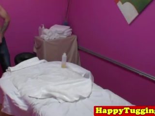 Asian handjob masseuse pulling cock